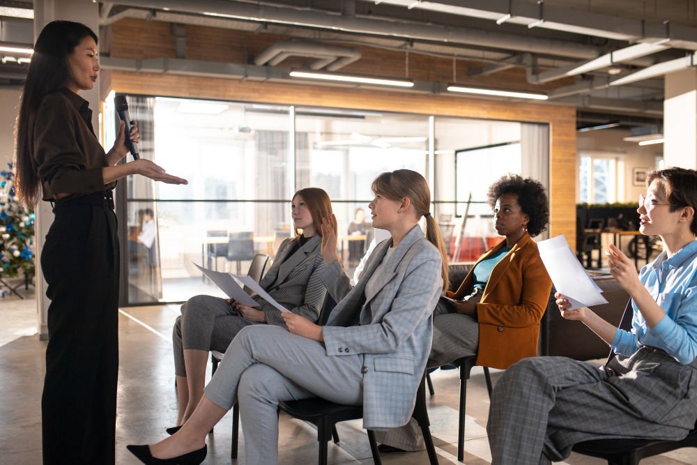 A trainer delivering training to leaders